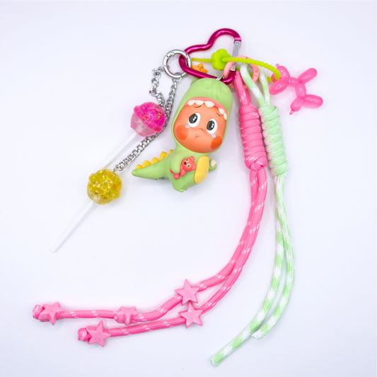 Pink heart keychain with Twinkle Twinkle Lose A Tooth figure from Be A Little Star Series and matching charms (pink and green lanyard, pink ballon doll on green rubber chain, pink and yellow lollipop on silver chain