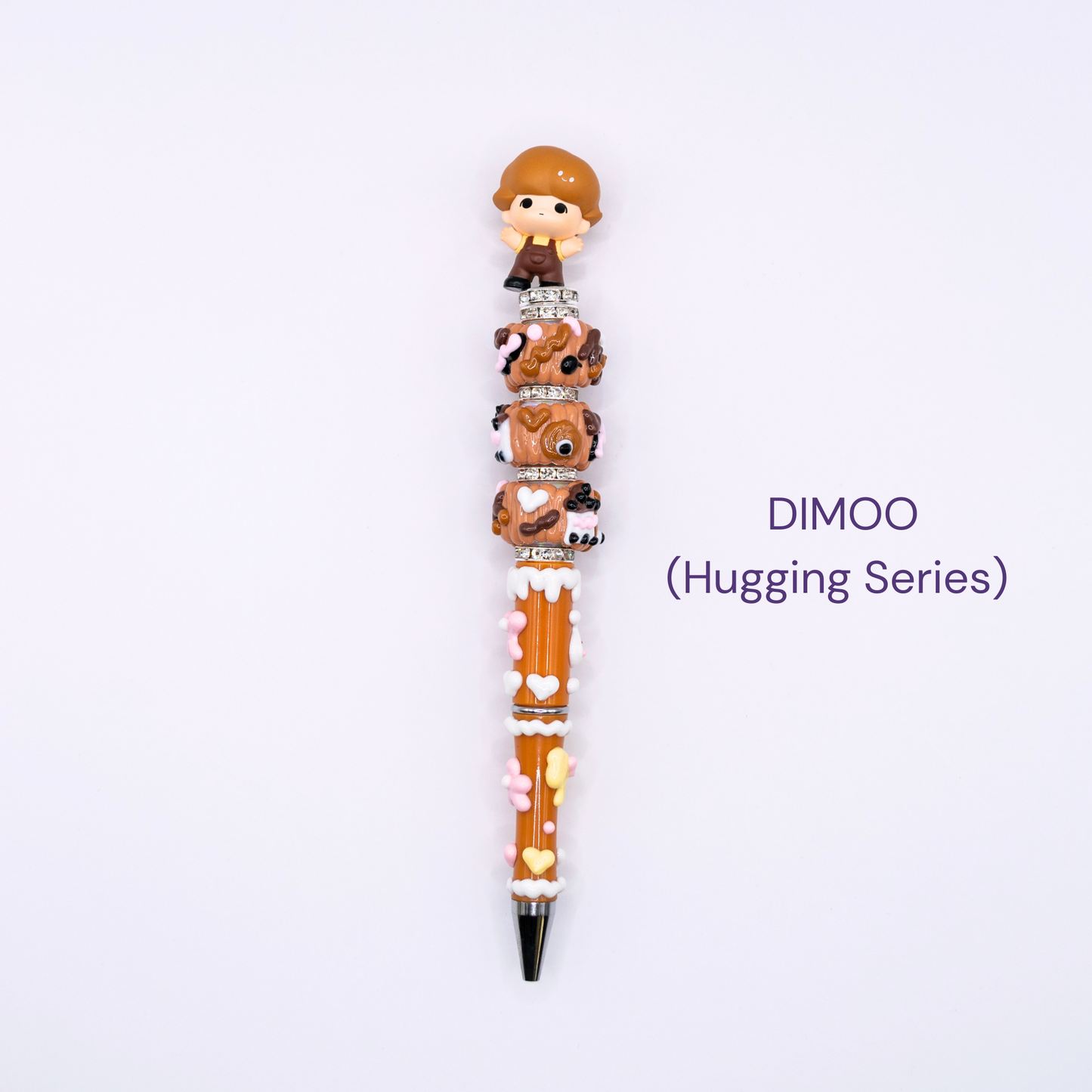 Beaded pen with cartoon character design on a white background, labeled 'DIMOO Hugging Series'.