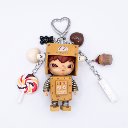 Keychain with Hirono Robot figure and various charms on a white background