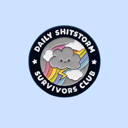 Button badge with a cloud design and text 'Daily Shitstorm Survivors Club' on a light blue background