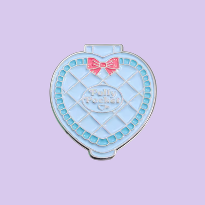 Heart-shaped blue pouch with a pink bow on a light purple background