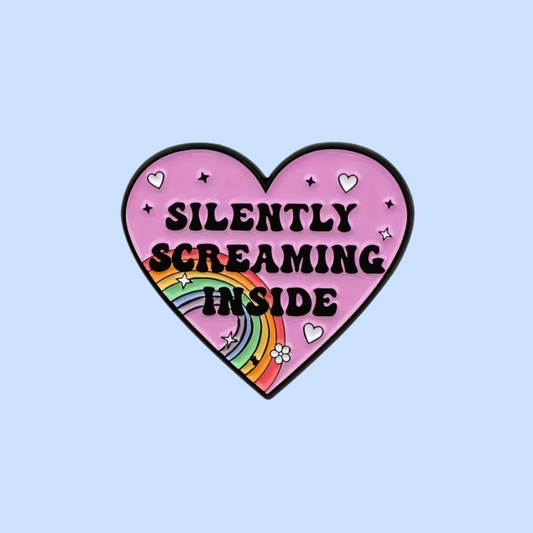 Heart-shaped sticker with 'Silently Screaming Inside' text and rainbow on a light blue background