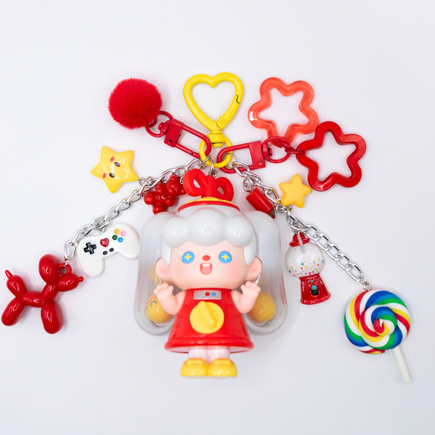 Heart keychain featuring Supertutu GAME START figure from Pop Mart's HAPPY-ING! Series and matching charms on white background