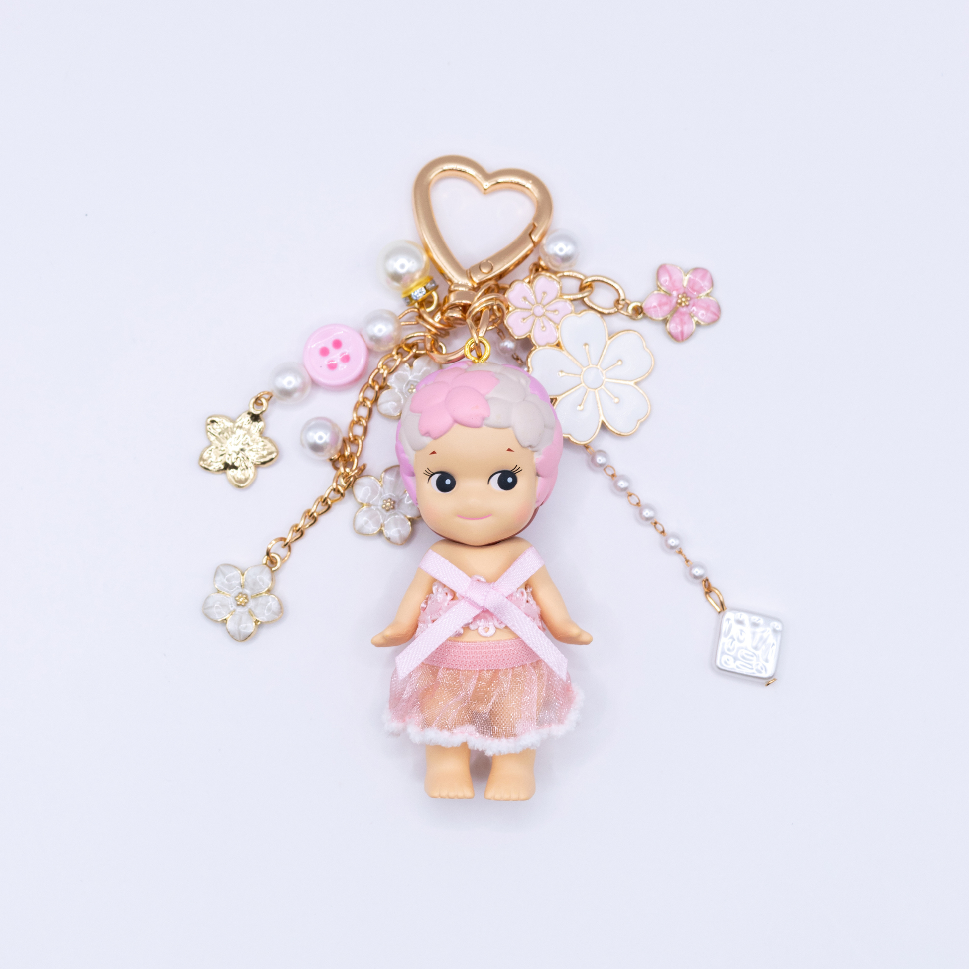 Golden heart Keychain featuring Cherry Blossoms Sonny Angel with matching clothes and pink and white charms