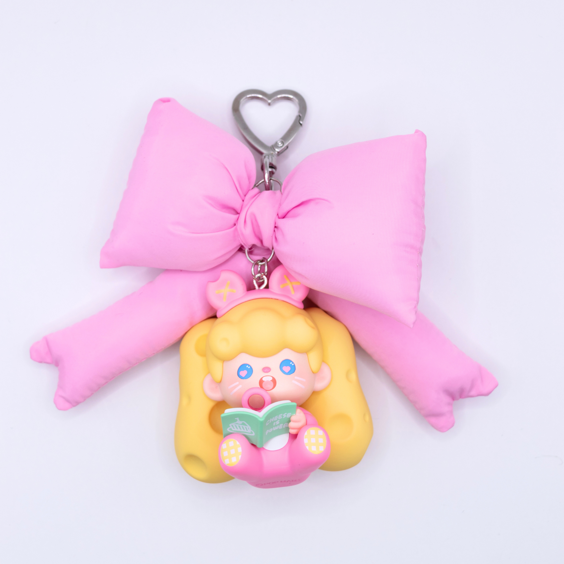 Heart keychain featuring Supertutu figure from Pop Mart's HAPPY-ING! Series and a pink bow