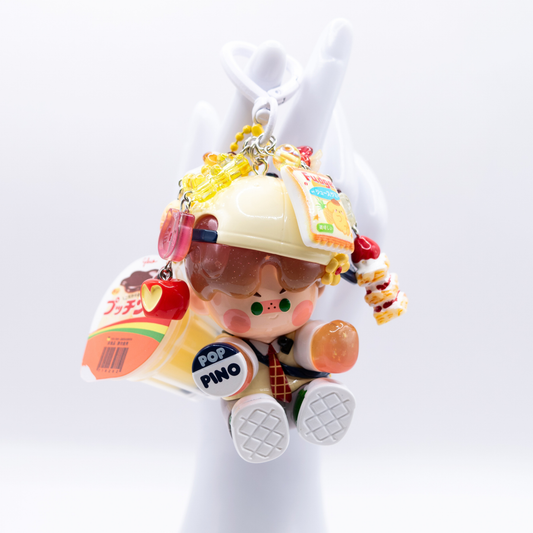 White heart keychain with Pino Jelly Variety Show figure from the Star Project Series and matching charms including a jelly pudding 