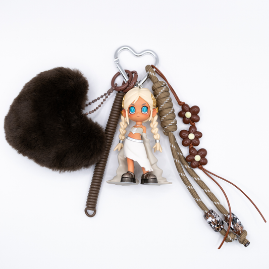 Silver heart keychain featuring Lil Peach Riot Poppy Valkyrie from the Loading series with matching charms including a beige lanyard with beads, brown flower charms, a faux fur heart and a plastic twisting lanyard