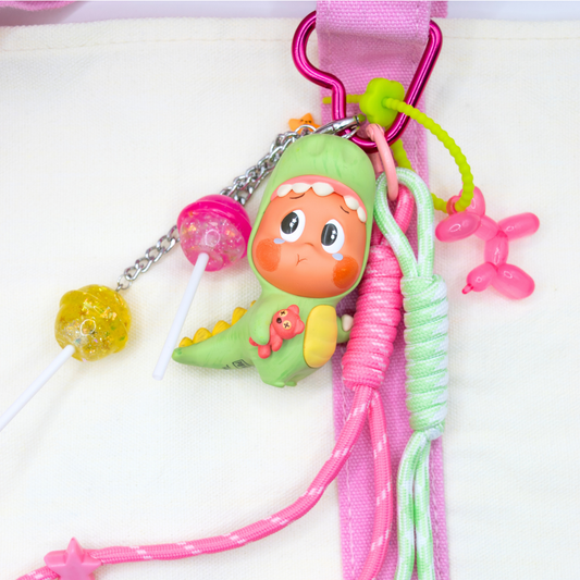 Pink heart keychain with Twinkle Twinkle Lose A Tooth figure from Be A Little Star Series and matching charms (pink and green lanyard, pink ballon doll on green rubber chain, pink and yellow lollipop on silver chain