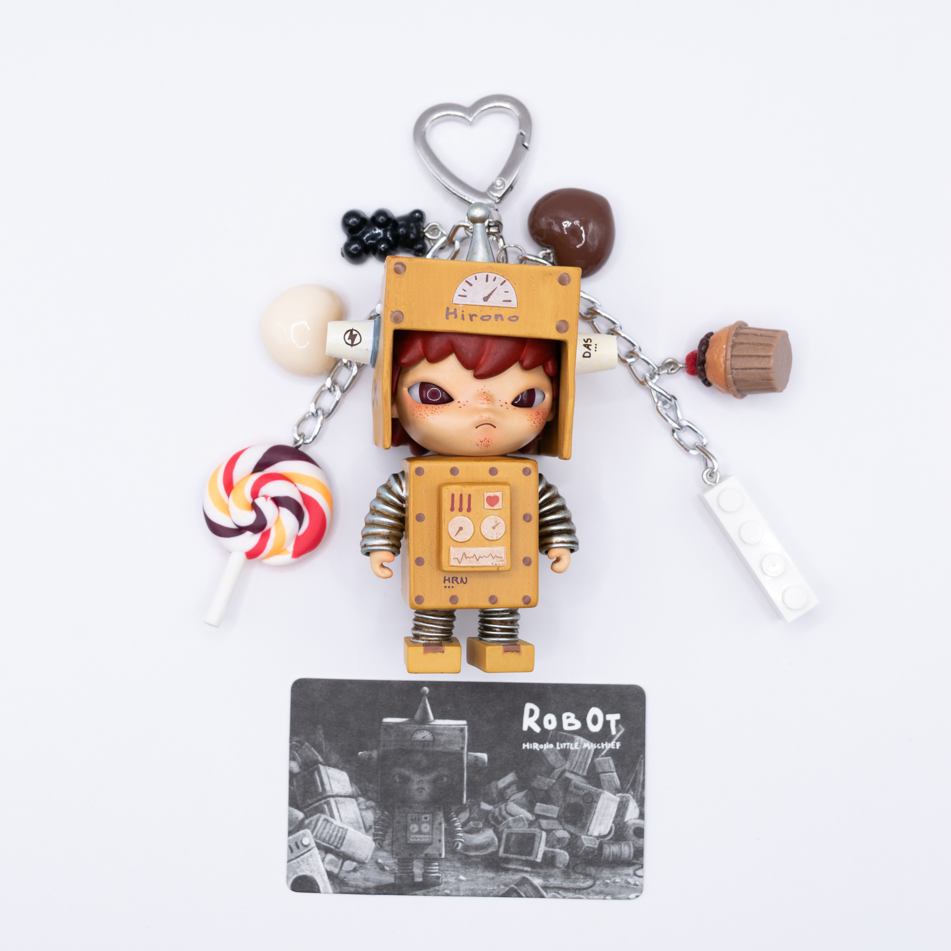 Keychain with Hirono Robot figure and various charms on a white background with its character card at the bottom
