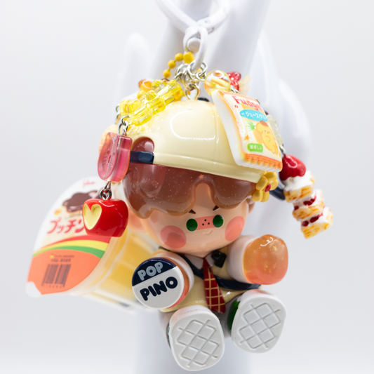 White heart keychain with Pino Jelly Variety Show figure from the Star Project Series and matching charms including a jelly pudding 