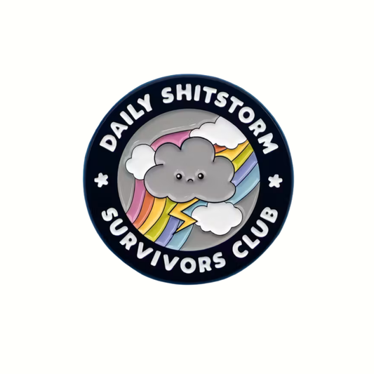 Button badge with cloud design and text 'Daily Shitstorm Survivors Club' on a white background