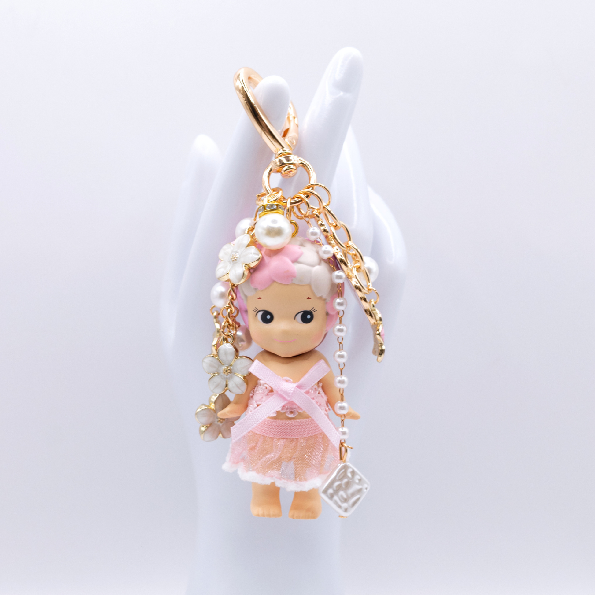 Golden heart Keychain featuring Cherry Blossoms Sonny Angel with matching clothes and pink and white charms