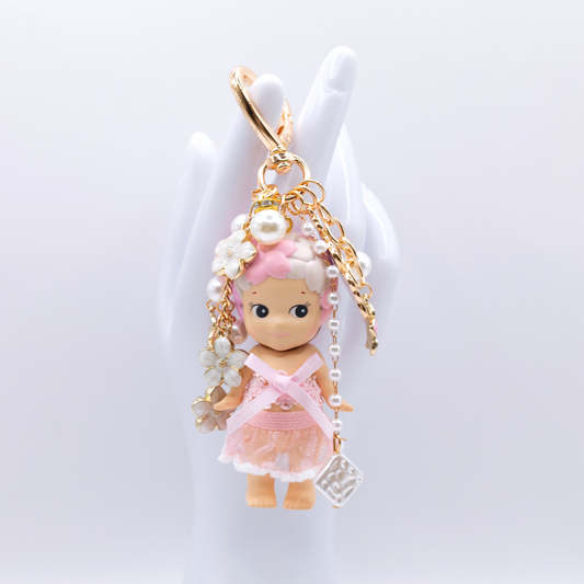Golden heart Keychain featuring Cherry Blossoms Sonny Angel with matching clothes and pink and white charms