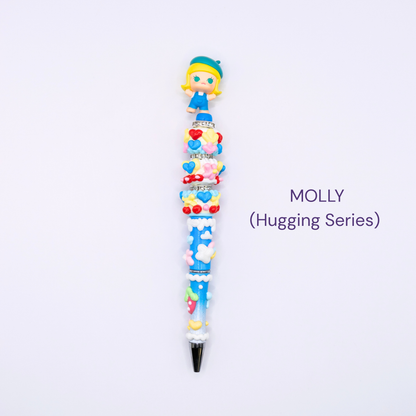 Colorful beaded pen with cartoon character design on a white background, labeled 'MOLLY Hugging Series'.