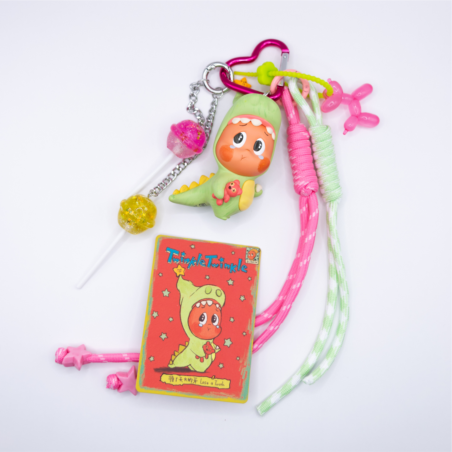 Pink heart keychain with Twinkle Twinkle Lose A Tooth figure from Be A Little Star Series and matching charms (pink and green lanyard, pink ballon doll on green rubber chain, pink and yellow lollipop on silver chain