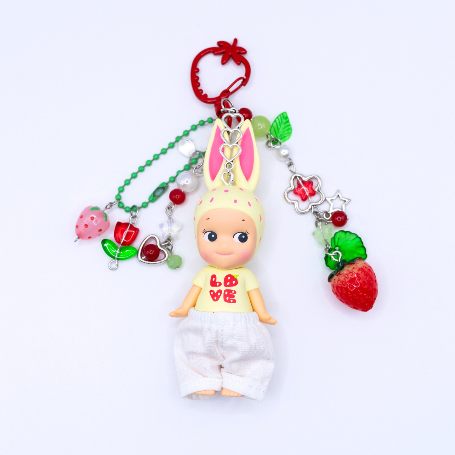 Sonny Angel keychains with Rabbit figure from the Strawberry Love series on a red strawberry clasp with matching beads