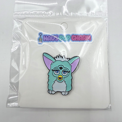 Cartoon character charm in a clear plastic packaging with 'Haus Pop Charm' branding.