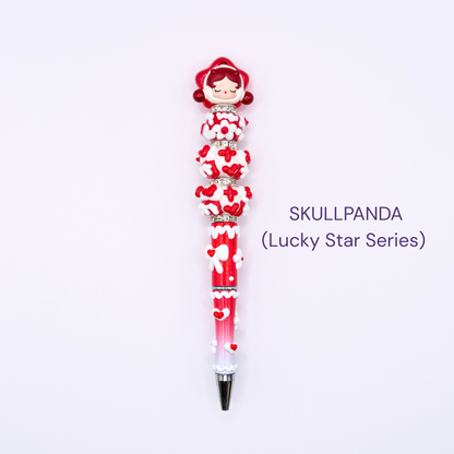 Colorful beaded pen with cartoon character design on a white background, labeled 'Skullpanda Lucky Star Series'.