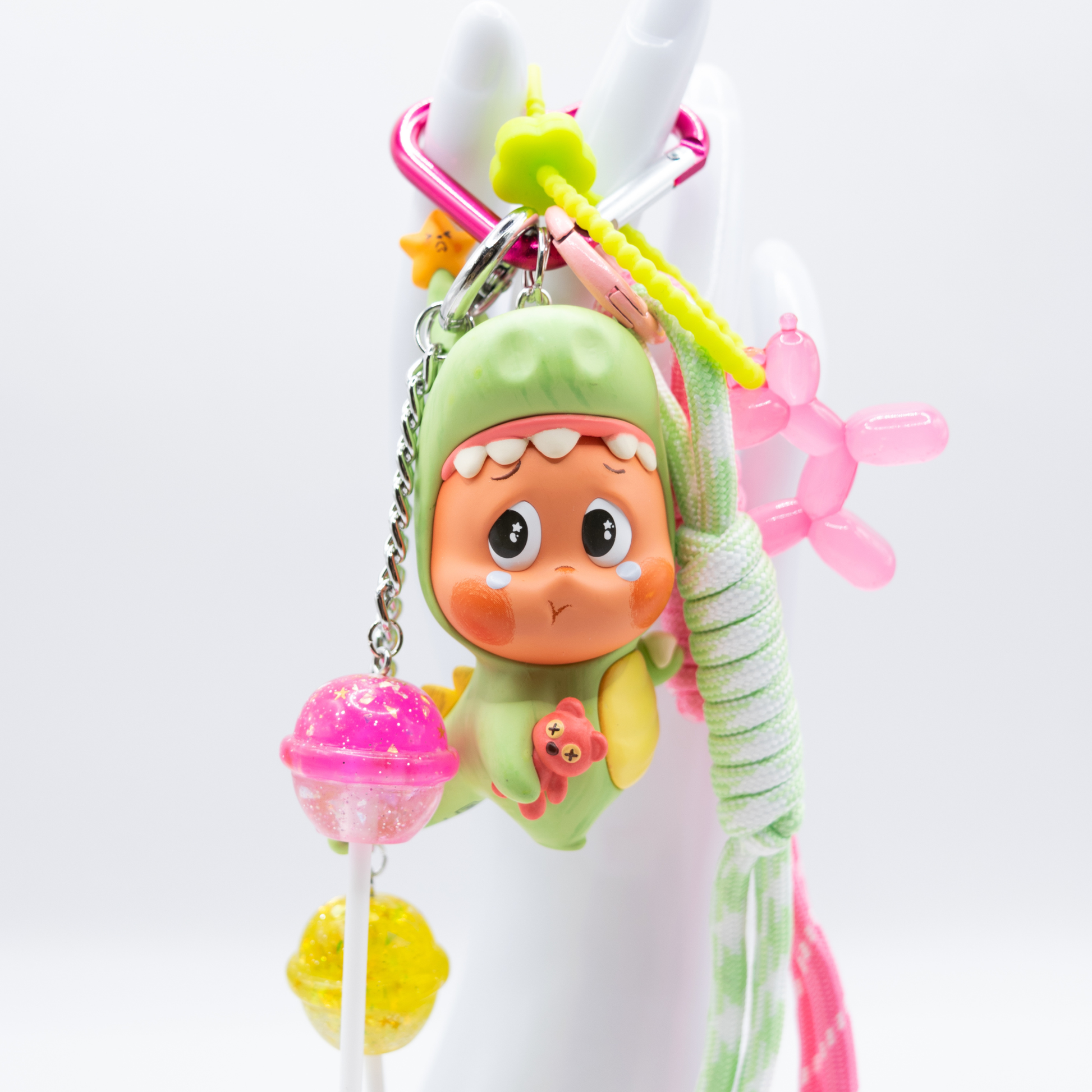 Pink heart keychain with Twinkle Twinkle Lose A Tooth figure from Be A Little Star Series and matching charms (pink and green lanyard, pink ballon doll on green rubber chain, pink and yellow lollipop on silver chain