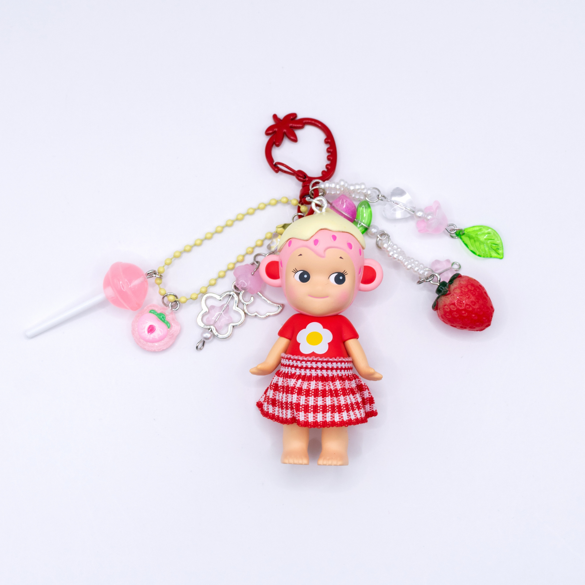 Sonny Angel keychains with Monkey figure from the Strawberry Love series on a red strawberry clasp with matching beads