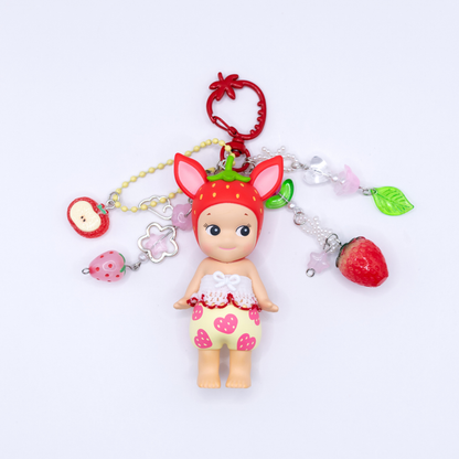 Sonny Angel keychains with Fawn figure from the Strawberry Love series on a red strawberry clasp with matching beads