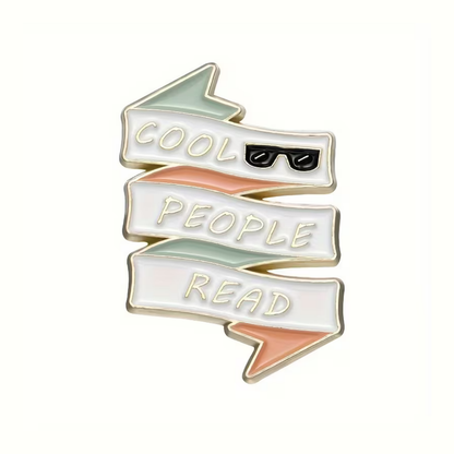 Enamel pin with 'Cool people read' text and sunglasses icon on a white background