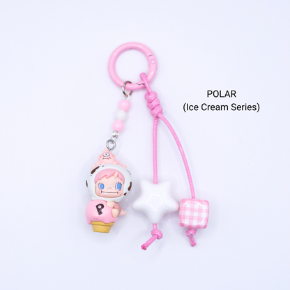 Pink keychain with Polar pop bean from the Ice Cream Series with matching star and dice charms