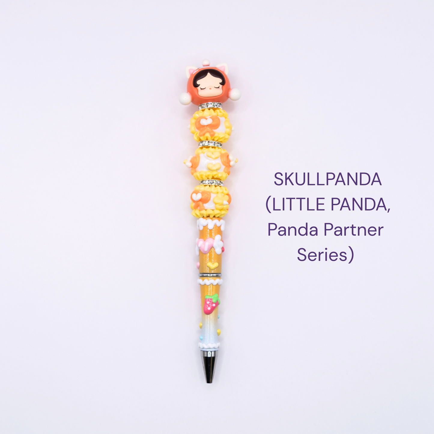 Colorful beaded pen with cartoon character design on a white background, labeled 'SKULLPANDA Little Panda Series.