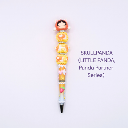 Colorful beaded pen with cartoon character design on a white background, labeled 'SKULLPANDA Little Panda Series.